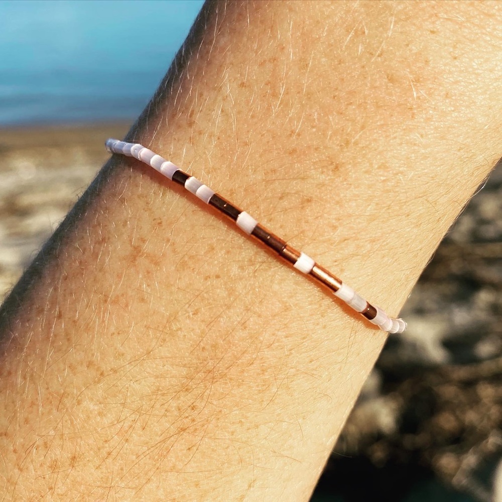 Pink and copper beaded bracelet on silk thread